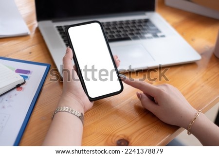 Closeup image of woman hands using smartphone, vertical view.