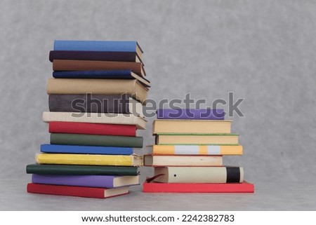 Pile of books on gray background