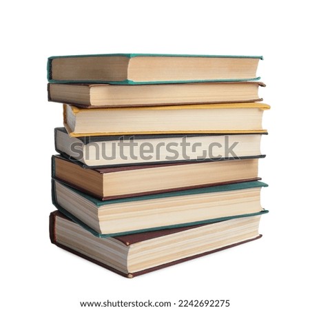 Stack of many old hardcover books isolated on white