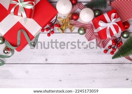 A wooden surface with a copy space surrounded by the Christmas decorations