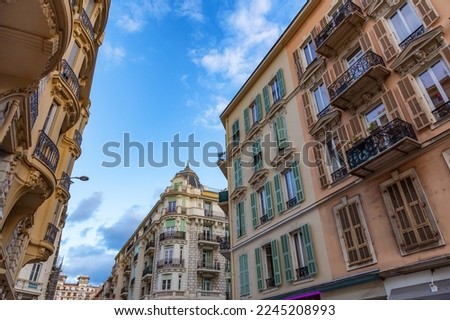 Old Architecture Apartment homes in Downtown Nice, France. Sunny Cloudy Day.