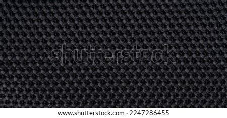 Black fabric texture knit background macro close up view