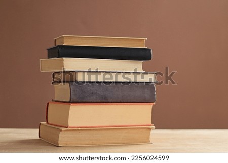 Pile of books on table in school