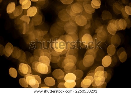 Blurred fire. Unfocused garland font. Round yellow spots. Open diaphragm.