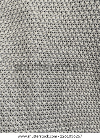 Grey or white knitted fabric and textile