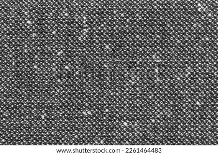 Black and white wool fabric texture closeup