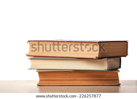 Books on desk with isolated background