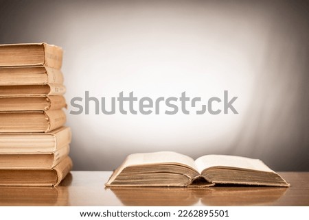 Many stacks of educational books at home preparing for exams on a white background