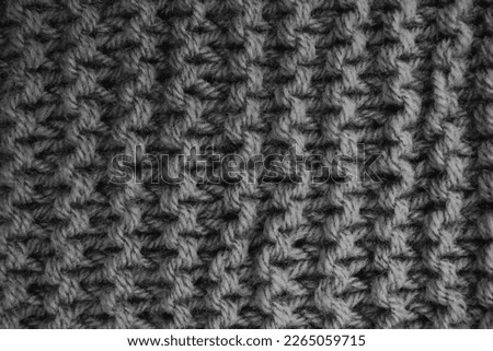 Background for design with copy space. Grey knitted wool