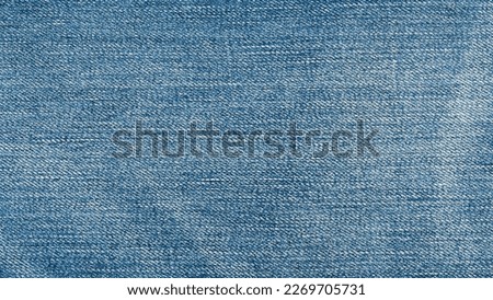 Trousers jean blue background.
Navy denim texture fabric surface pants.
top view.