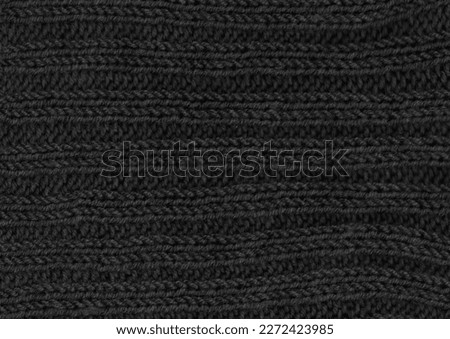 Organic knitting material with detail weave threads.
