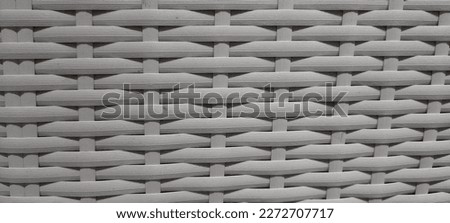 white rattan woven art on a wall