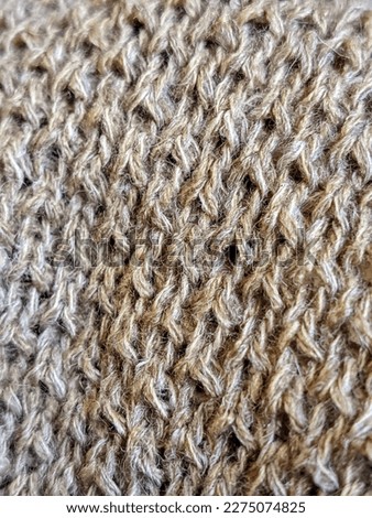 a brown and textured knit fabric