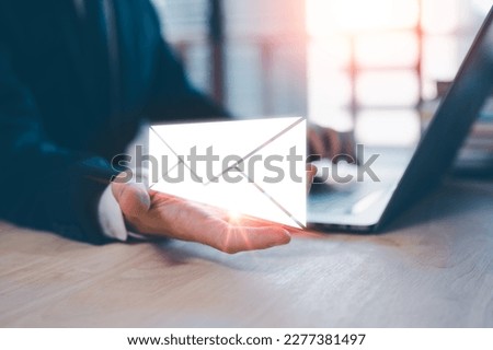 Email concept, businessman using computer laptop on table in office blurred background