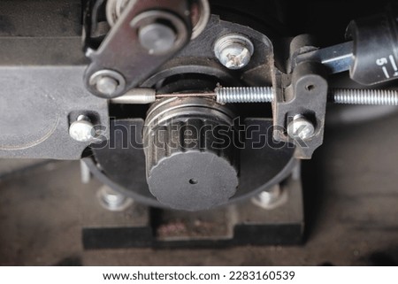 Pressure roller of the semi automatic welding machine close up.