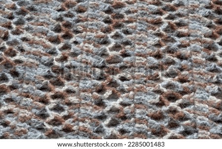 Knit pattern. Close-up of knitted wool texture. Knitted pattern color as background.