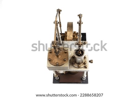 close up of a stirling engine construction with white table isolated on white background