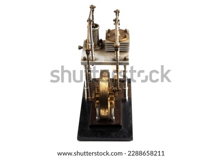 close up of a stirling engine construction with white table isolated on white background