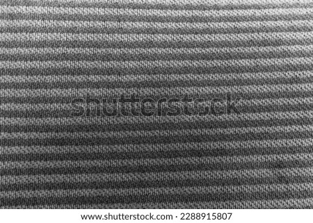 Rough black and white carpeting. Rustic interior design. Close-up. Space for text.
