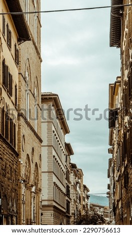 beautiful street in Florence in Italy with old buildings