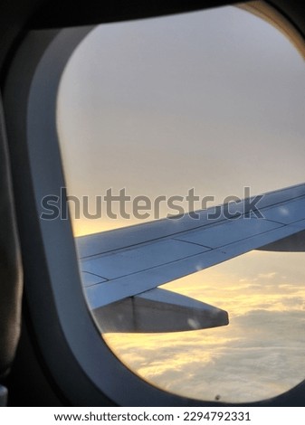 airplane window in a sunset