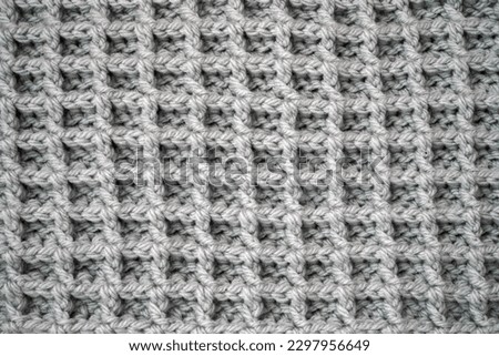 Green background, knitted cell, knitted wallpaper                               