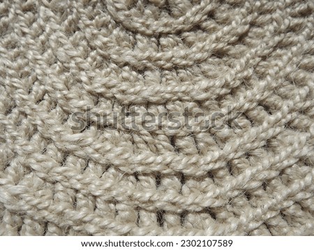Crocheting of jute, yarn, raffia white in a circle close-up as a background. High quality photo