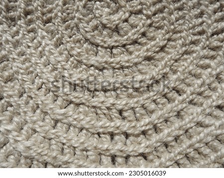 Crocheting of jute, yarn, raffia white in a circle close-up as a background. High quality photo
