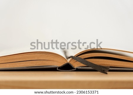 Book on a wooden shelf