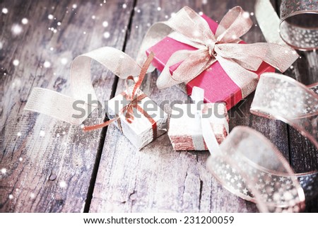 Christmas present  on wooden background in vintage style    