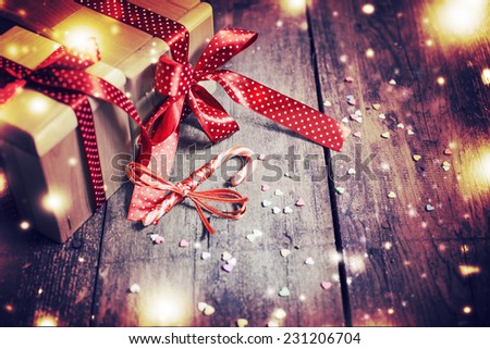 Christmas present  on wooden background in vintage style    