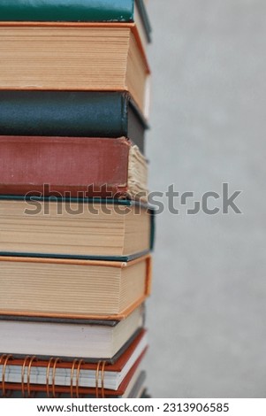 Stack of books on gray education