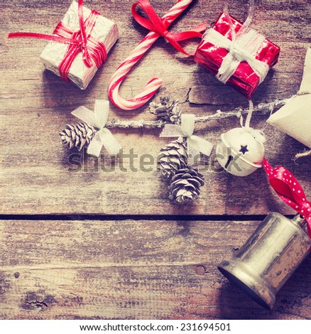 Jingle bells ,Christmas gifts and with candy canes over rusty background/ christmas holidays background