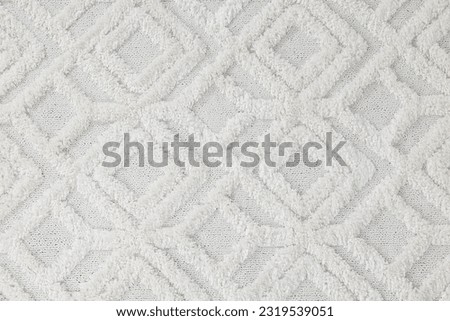 Soft light carpet as background, top view