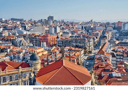Porto, Cobblestone-lined paths weaving through vibrant neighborhoods, showcasing historic architecture, colorful buildings, charming cafes, and lively atmosphere. A captivating blend of old-world.