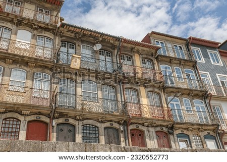 Facade of the historic house in the old town of Porto on the banks of the river 