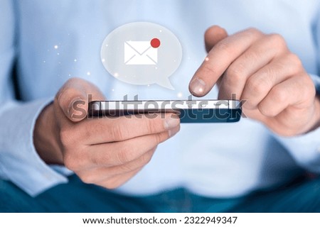 Human hand using modern smartphone with email icon