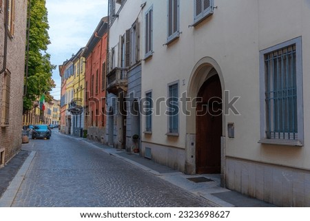 narrow street in the old town of Piacenza, Italy.