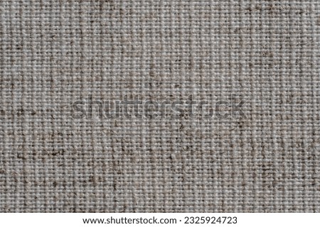 Natural vintage linen texture as background, macro. Light cream linen fabric texture, old rustic canvas. Top view, close up