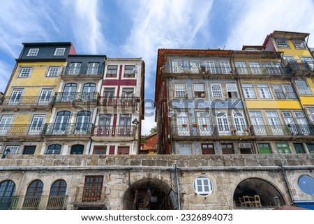 Beautiful colorful building facede in Porto Portugal with azulejo tiles in Ribeira .