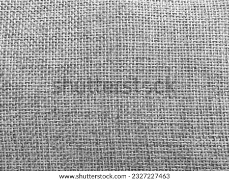 Grey cotton or knitted wool rough fabric of sofa cushion texture, abstract textile background, furniture uphostery