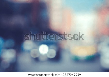 Blurred image of a car driving on the road and bokeh from lens melting for wallpaper, backdrop and design.