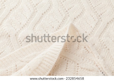 Detail of woven woolen design texture. Fabric white background