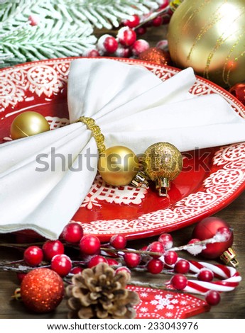 Festive table setting with Christmas decorations on wooden table