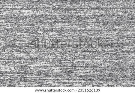 Close up abstract gray cotton heather texture background.  
Black and white texture knit fabric pattern seamless.
Selective focus.
top view.