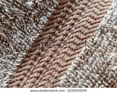 The texture of the brown terry cloth is unique and detailed