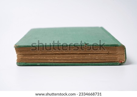 Dark green old. book on a white background                                