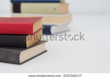 stack of different books on white background. space for text