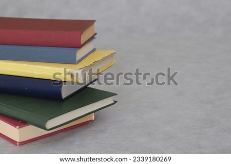 Pile of books on gray background education