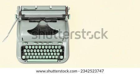 Banner of a retro green typewriter with copy space. Top view
